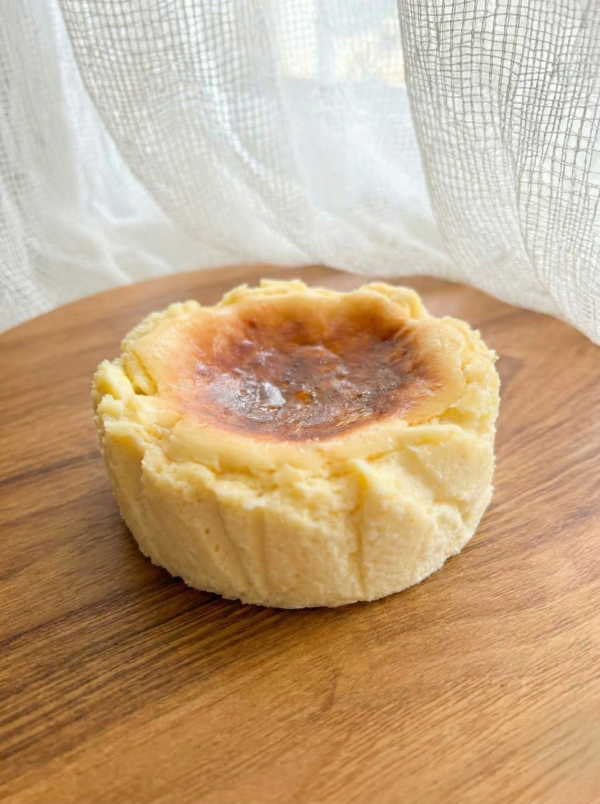 Soft and creamy Basque cheesecake side view with rustic texture