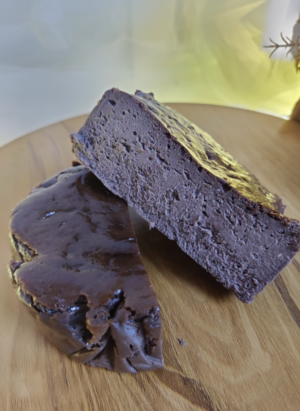 Chocolate burnt basque cheesecake slice showing rich creamy texture and soft center