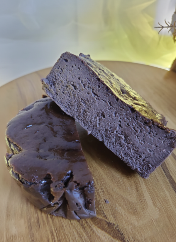 Chocolate burnt basque cheesecake slice showing rich creamy texture and soft center