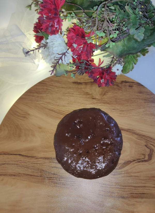 Chocolate burnt cheesecake whole cake top view with glossy surface