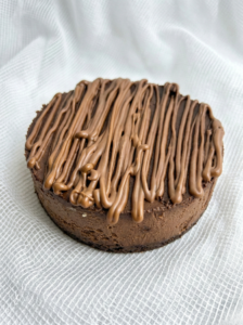 Chocolate cheesecake with rich chocolate drizzle topping and creamy base