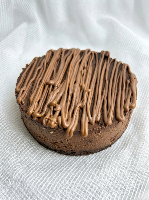 Chocolate cheesecake with rich chocolate drizzle topping and creamy base