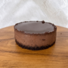 Chocolate cheesecake with smooth ganache top and dense creamy texture