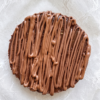 Top view of chocolate cheesecake with chocolate drizzle pattern