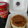 Lotus Biscoff cheesecake with biscoff spread jar and biscuit topping