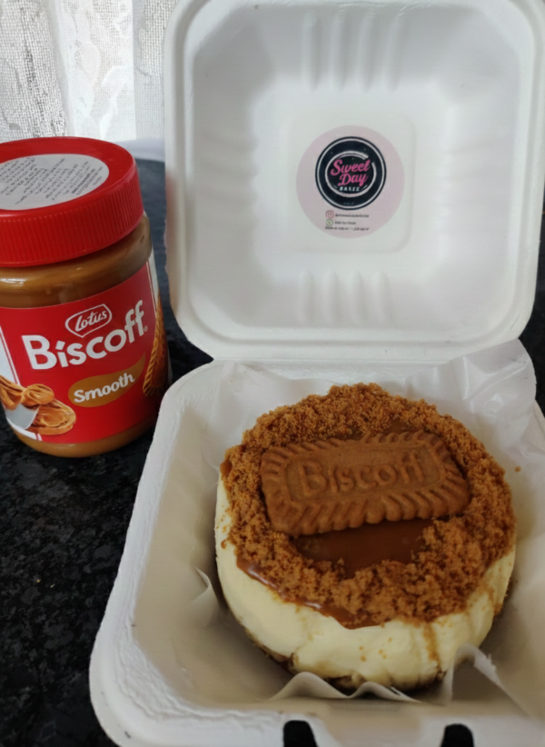 Lotus Biscoff cheesecake with biscoff spread jar and biscuit topping