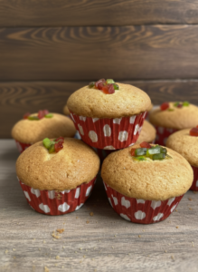 Soft and fluffy vanilla cupcakes with light golden top in paper liners